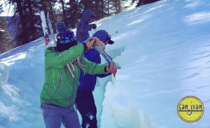Avalanche Training students dig a snowsuit in Telluride Colorado