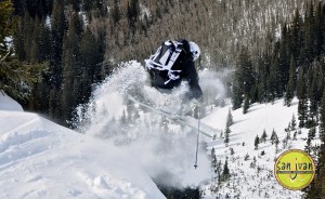 Backcountry skier launches of pillow of snow in Telluride Colorado