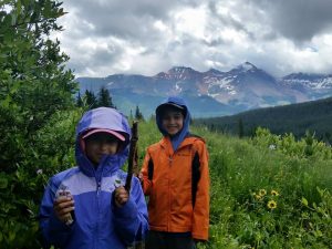 two kids hiking in colorado